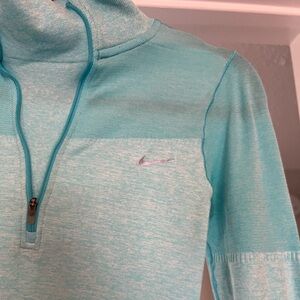 Nike teal women’s pullover shirt!  With thumb cutouts. Nike running brand.